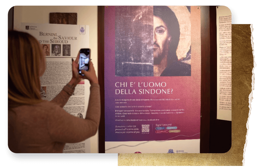 Woman scanning information with her phone at Shroud of Turin exhibit
