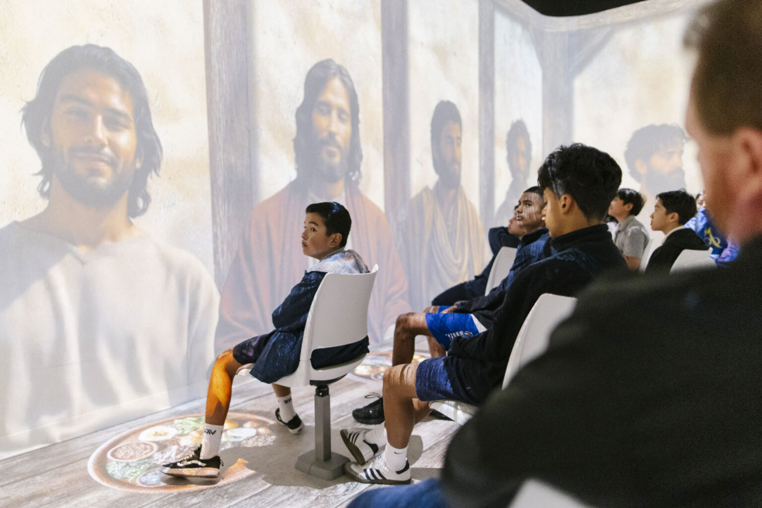 Students watching a presentation inside one of the immersive theaters